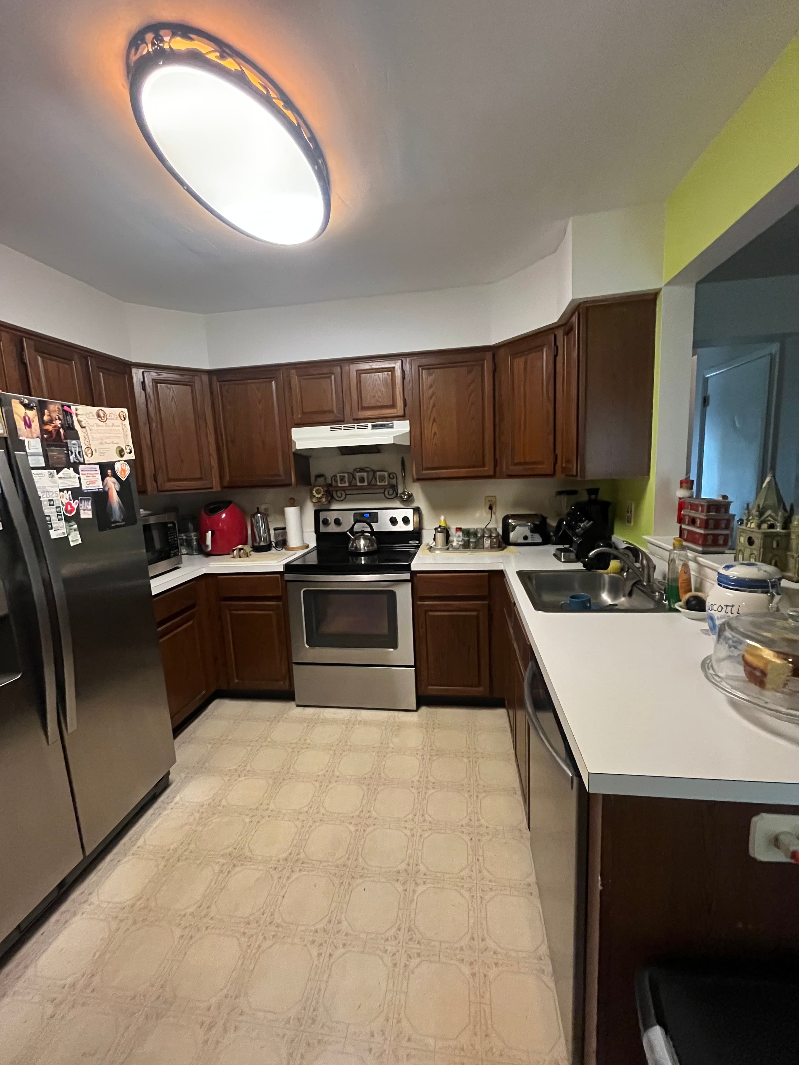 Side-by-side comparison of kitchen floor before and after renovation